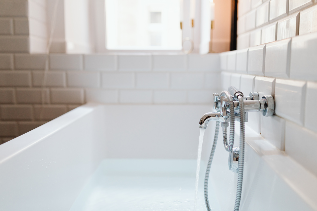 Stainless Steel Faucet on White Ceramic Sink